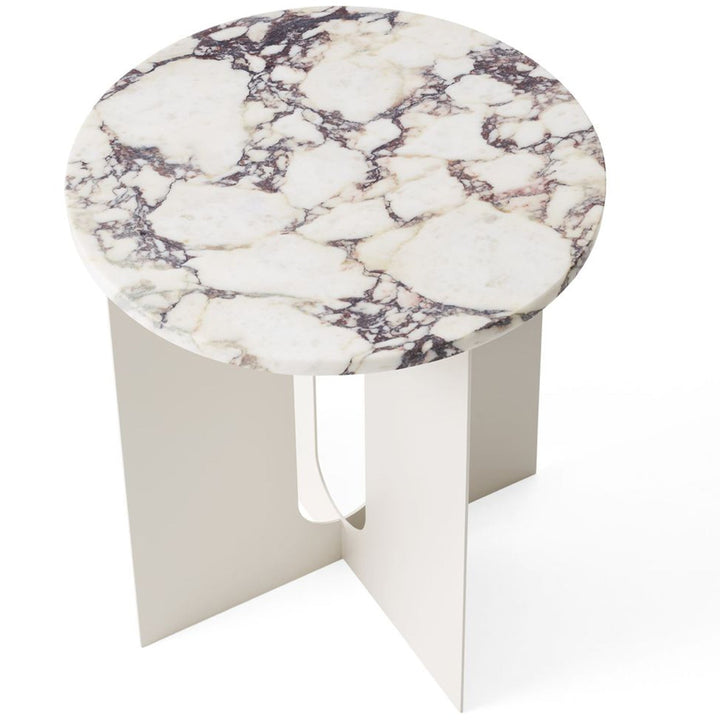 Androgyne Metal Side Table by Audo Copenhagen - The perfectly proportioned table comprises a sturdy powder coated steel base on which a rounded marble tabletop is balanced. The table’s refined marble top, which barely hangs over the legs to create an over