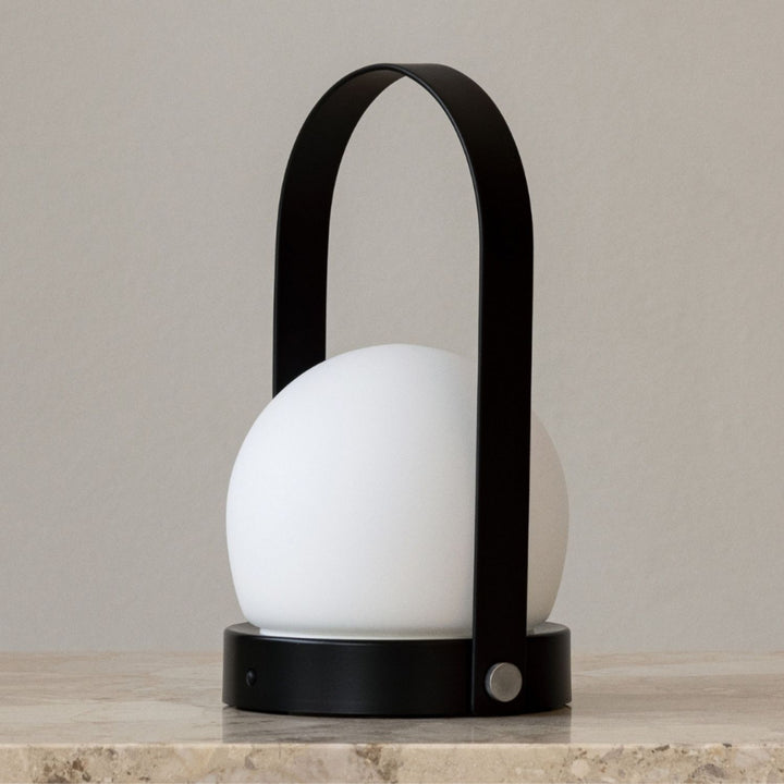 AUDO CPH (ex MENU) Carrie Lamp Portable + Rechargeable, Black by Audo Copenhagen - A minimalist innovation for freedom and flexibility, the Carrie Table Lamp, portable with a metal base and glass shade is unique for its multiple uses and mutability. Usefu