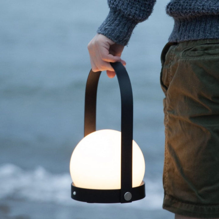 AUDO CPH (ex MENU) Carrie Lamp Portable + Rechargeable, Black by Audo Copenhagen - A minimalist innovation for freedom and flexibility, the Carrie Table Lamp, portable with a metal base and glass shade is unique for its multiple uses and mutability. Usefu