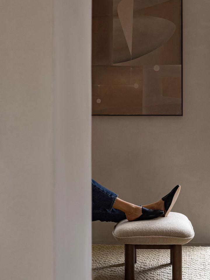 AUDO CPH Brasilia Ottoman, Sheepskin by Audo Copenhagen - The sheepskin edition of AUDO CPH Brasilia Ottoman features a durable, cylindrical leg design and a gently curved cushion. Taking inspiration from mid-20th century Danish craftsmanship and Brazilia