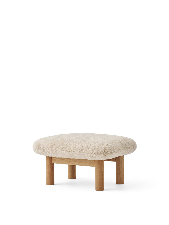 AUDO CPH Brasilia Ottoman, Sheepskin by Audo Copenhagen - The sheepskin edition of AUDO CPH Brasilia Ottoman features a durable, cylindrical leg design and a gently curved cushion. Taking inspiration from mid-20th century Danish craftsmanship and Brazilia
