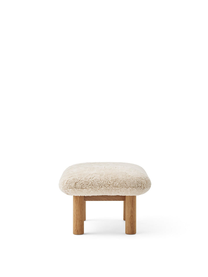AUDO CPH Brasilia Ottoman, Sheepskin by Audo Copenhagen - The sheepskin edition of AUDO CPH Brasilia Ottoman features a durable, cylindrical leg design and a gently curved cushion. Taking inspiration from mid-20th century Danish craftsmanship and Brazilia