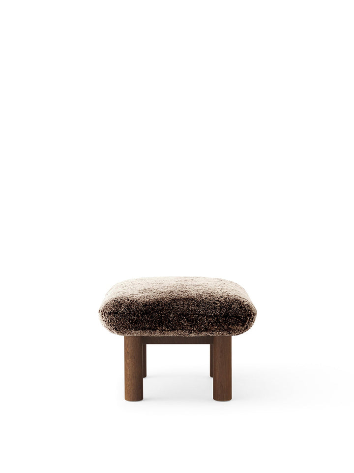AUDO CPH Brasilia Ottoman, Sheepskin by Audo Copenhagen - The sheepskin edition of AUDO CPH Brasilia Ottoman features a durable, cylindrical leg design and a gently curved cushion. Taking inspiration from mid-20th century Danish craftsmanship and Brazilia