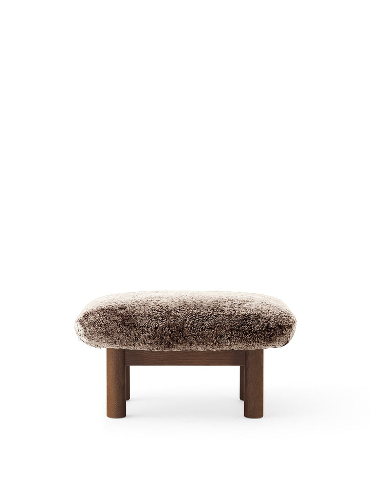 AUDO CPH Brasilia Ottoman, Sheepskin by Audo Copenhagen - The sheepskin edition of AUDO CPH Brasilia Ottoman features a durable, cylindrical leg design and a gently curved cushion. Taking inspiration from mid-20th century Danish craftsmanship and Brazilia