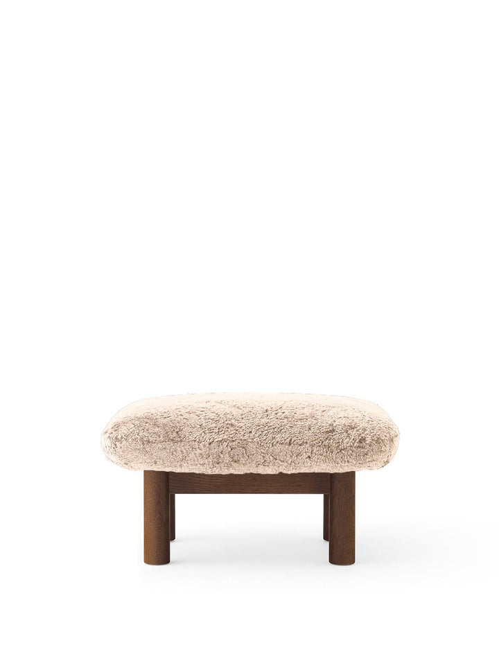 AUDO CPH Brasilia Ottoman, Sheepskin by Audo Copenhagen - The sheepskin edition of AUDO CPH Brasilia Ottoman features a durable, cylindrical leg design and a gently curved cushion. Taking inspiration from mid-20th century Danish craftsmanship and Brazilia