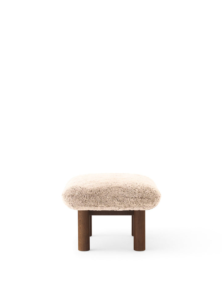 AUDO CPH Brasilia Ottoman, Sheepskin by Audo Copenhagen - The sheepskin edition of AUDO CPH Brasilia Ottoman features a durable, cylindrical leg design and a gently curved cushion. Taking inspiration from mid-20th century Danish craftsmanship and Brazilia