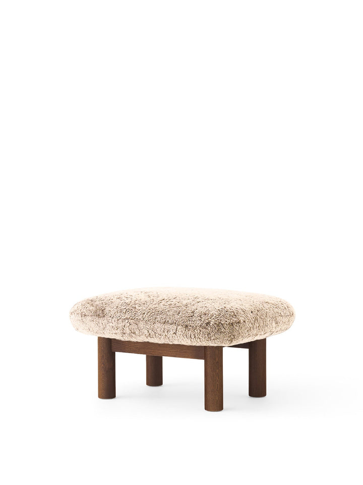 AUDO CPH Brasilia Ottoman, Sheepskin by Audo Copenhagen - The sheepskin edition of AUDO CPH Brasilia Ottoman features a durable, cylindrical leg design and a gently curved cushion. Taking inspiration from mid-20th century Danish craftsmanship and Brazilia