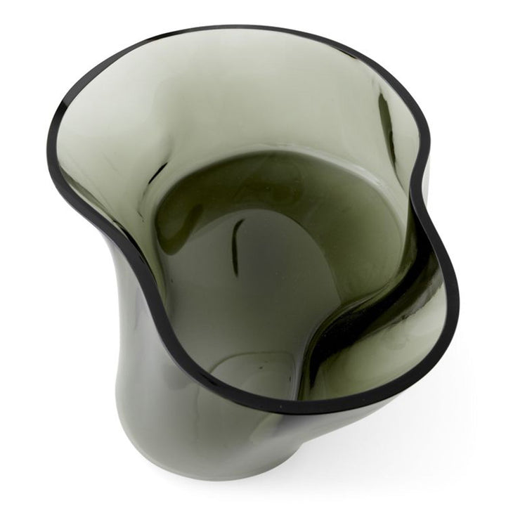 Aer Bowl by Audo Copenhagen - The undulating Aer Bowl in smoke glass brings sculptural appeal to surfaces—whether filled with treats or placed on a surface as a decorative object. Taking its cues from the spiralling movement of air seen through smoke or m