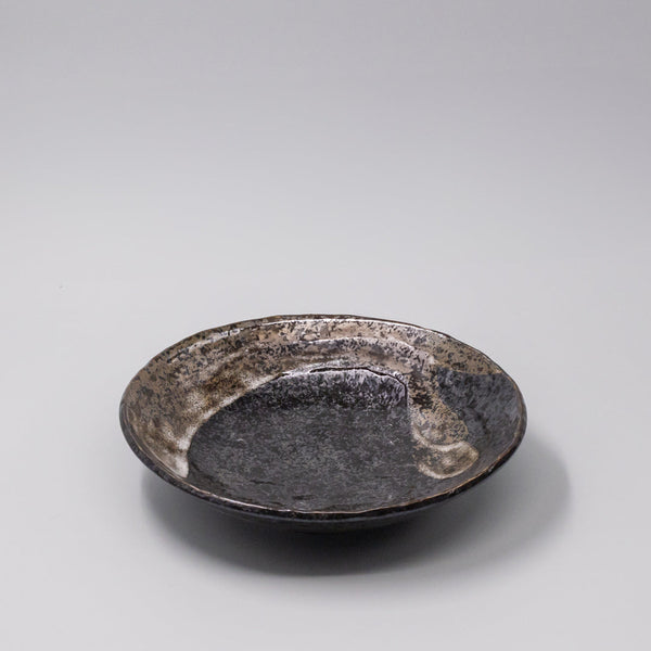 24cm handcrafted bowl with brushstroke black glaze, perfect for salads and pasta, showcasing a modern sculptural design.