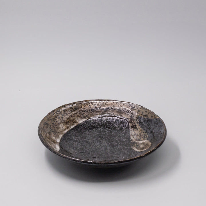 24cm handcrafted bowl with brushstroke black glaze, perfect for salads and pasta, showcasing a modern sculptural design.