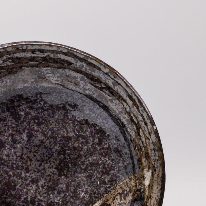 24cm handcrafted bowl in deep brushstroke black glaze, perfect for serving salads and pasta.