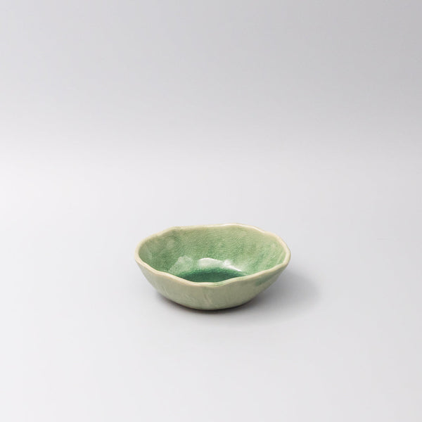 Oval 13.5cm bowl in jade green glaze, featuring an organic shape and fine crackle detailing, ideal for dips or sauces.
