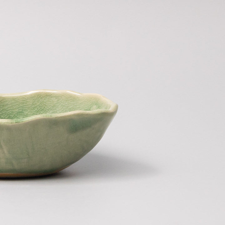 Oval 13.5cm Amane dish in glossy jade green glaze, featuring fine crackle detailing for a handcrafted look.