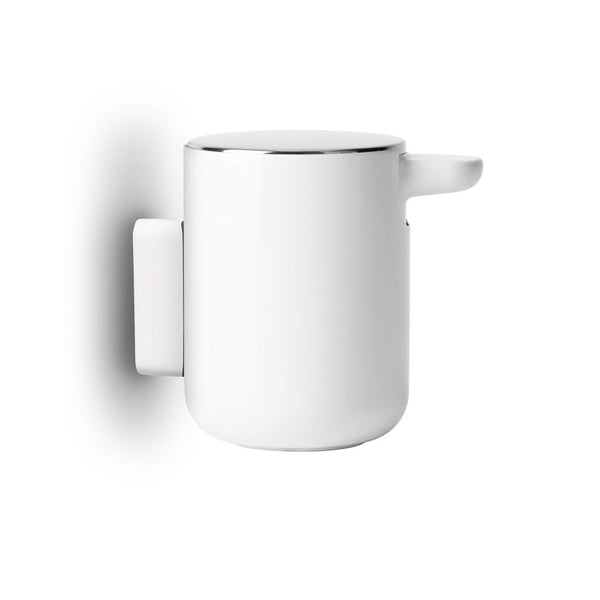 AUDO CPH (ex MENU) Soap Pump/Soap Dispenser Wall Mount, White by Audo Copenhagen - This soap pump is designed with convenience and ease in mind, making cleaning effortless. With its simple refill process and modern brushed steel lid, you'll love using thi