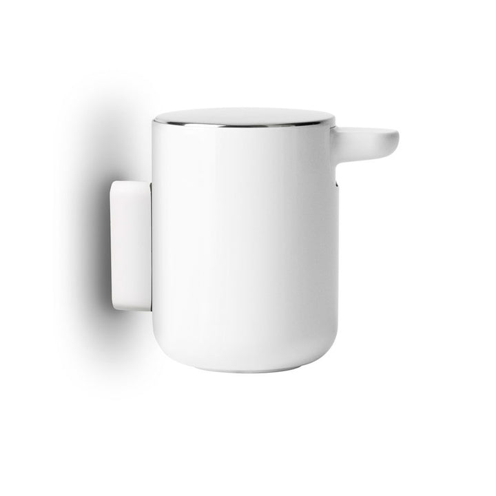 AUDO CPH (ex MENU) Soap Pump/Soap Dispenser Wall Mount, White by Audo Copenhagen - This soap pump is designed with convenience and ease in mind, making cleaning effortless. With its simple refill process and modern brushed steel lid, you'll love using thi