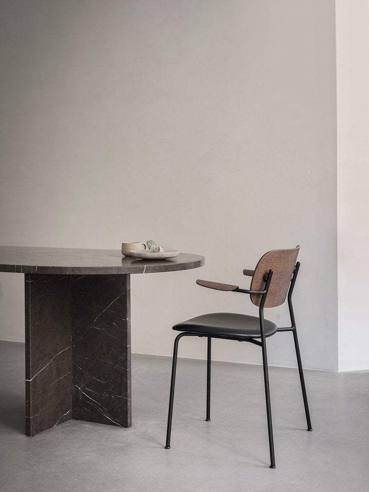 Co Dining Chair, with armrest, Black, Veneer by Audo Copenhagen - Together, mutually, in common: the words that define the prefix ‘co-’ are at the heart of our new Co Dining Chair design. Conceived in collaboration with The Office Group and Norm Architect