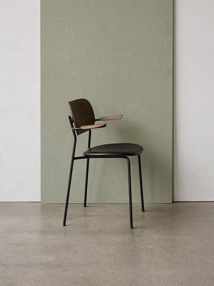 Co Dining Chair, with armrest, Black, Veneer by Audo Copenhagen - Together, mutually, in common: the words that define the prefix ‘co-’ are at the heart of our new Co Dining Chair design. Conceived in collaboration with The Office Group and Norm Architect