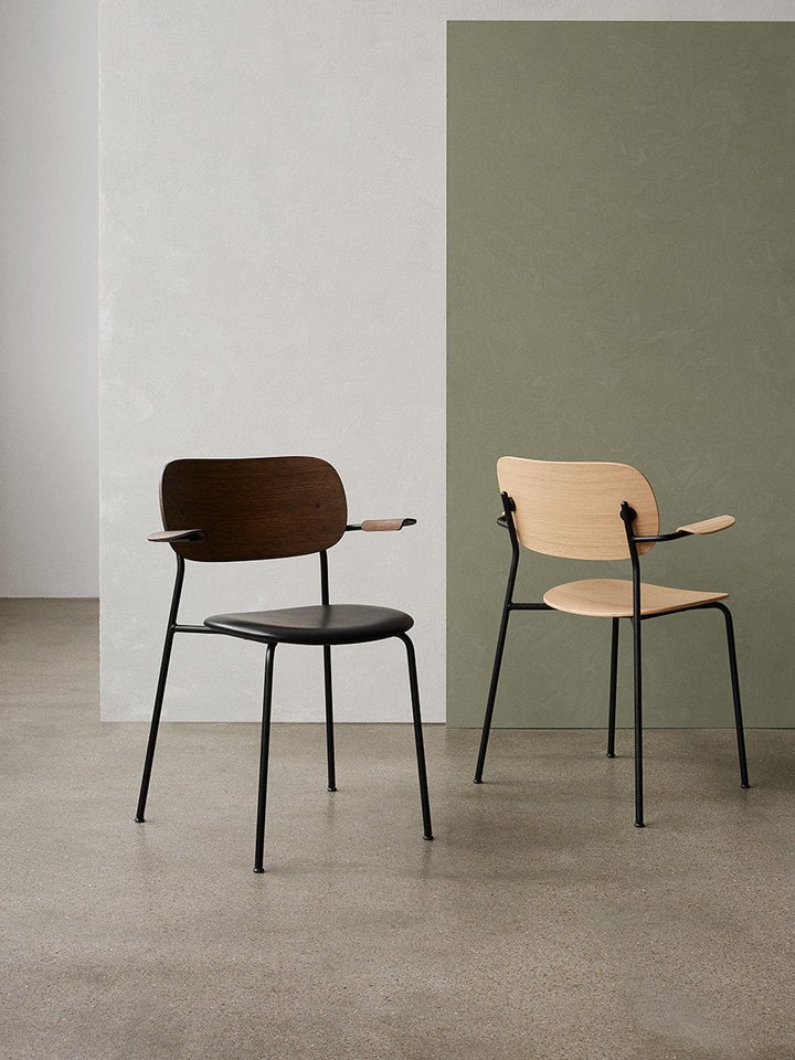 Co Dining Chair, with armrest, Black, Veneer by Audo Copenhagen - Together, mutually, in common: the words that define the prefix ‘co-’ are at the heart of our new Co Dining Chair design. Conceived in collaboration with The Office Group and Norm Architect