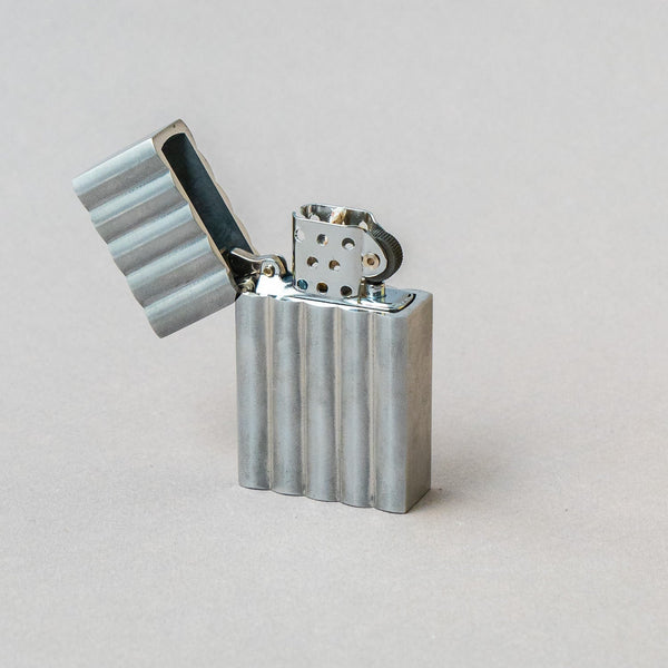 Tsubota Pearl Aluminium Wave Lighter, handcrafted in Tokyo, featuring a sleek design and durable metal construction.