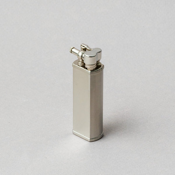 TSUBOTA PEARL Bolbo Silver Lighter, handcrafted metal petrol lighter in sleek design, made in Tokyo.