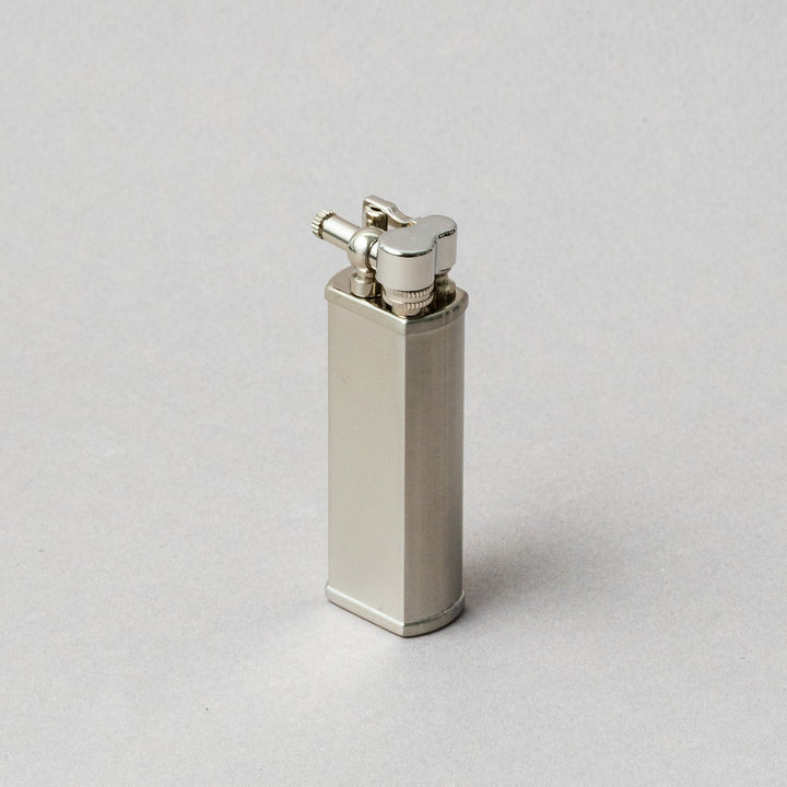 TSUBOTA PEARL Bolbo Silver Lighter, handcrafted metal petrol lighter in sleek design, made in Tokyo.