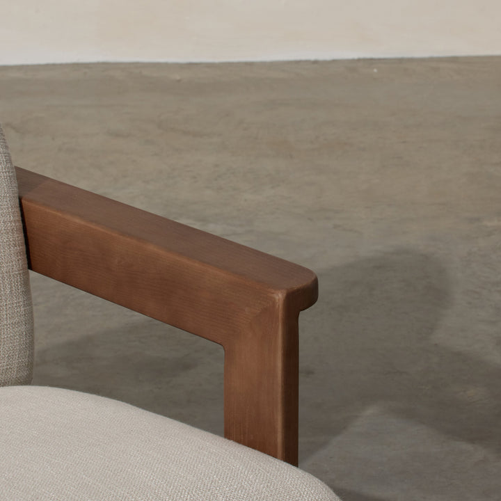 Corwin Occasional Chair Greige Our Corwin Occasional Armchair is mid-century inspired statement piece that blends sculptural elegance and grounded design. This unique upholstere chair features wooden arms that seamlessly extend into the base, eliminating