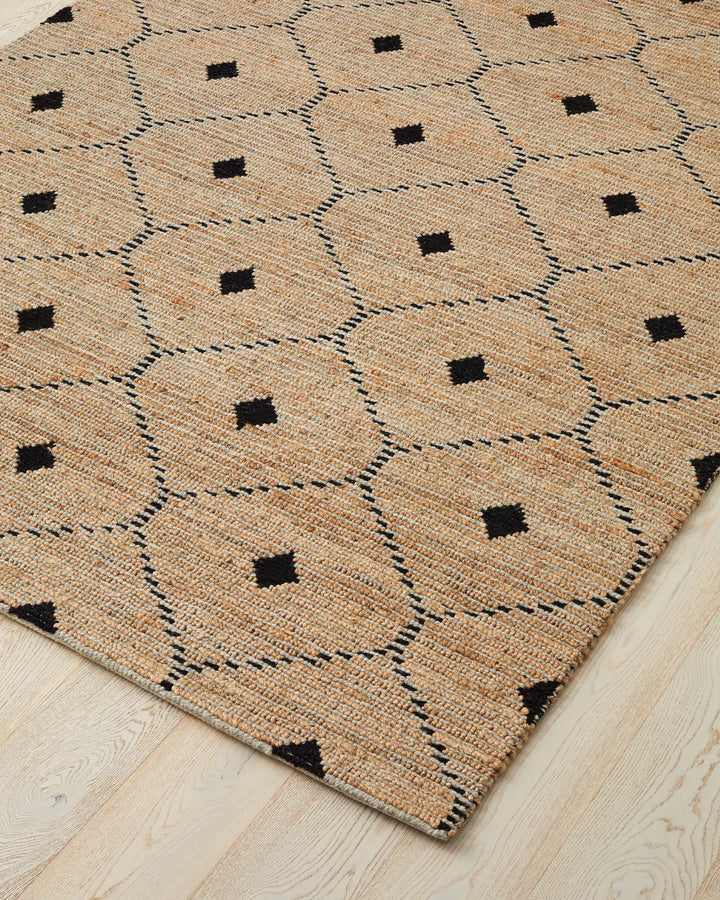 Denali Sandstorm - Weave This beautiful Denali rug boasts a unique hand-woven aesthetic and a repetitive diamond pattern. Its elegant design is versatile and complements striking furniture and metallic accents. Made from a combination of 50% wool and 50%