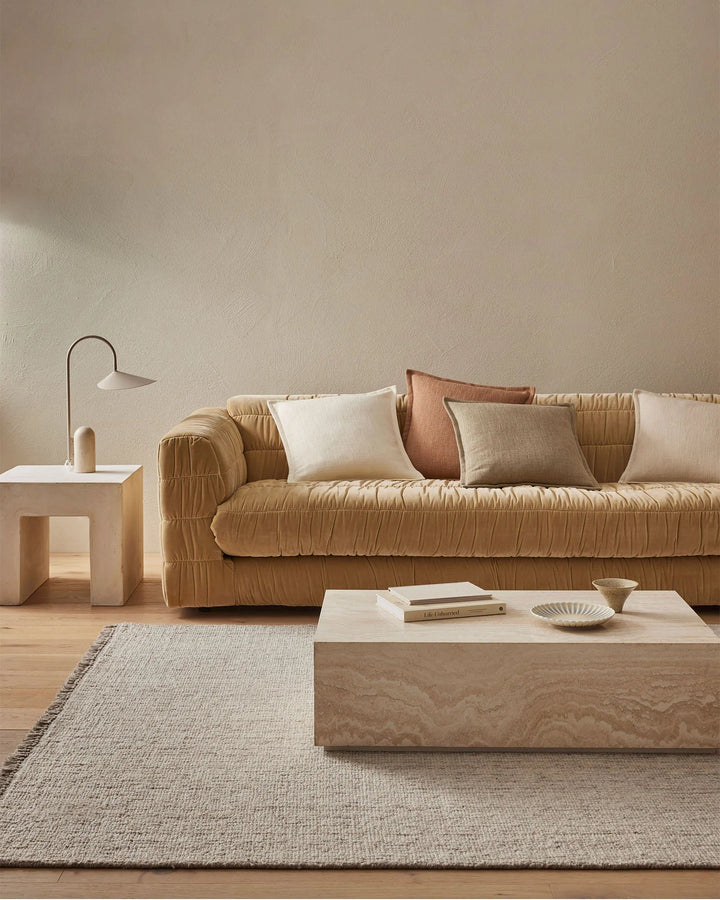 Figlio Fossil Expertly crafted to resemble a chunky woven linen, the Figlio cushion exudes a natural charm that seamlessly blends with any décor style.The Fossil colourway of Figlio is a light taupe that adds a touch of refinement while maintaining a cosy