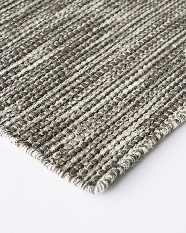 Abbas Floor Rug Tightly handwoven from a dense wool blend, the flatweave design and generous size of our Abbas makes this rug perfect for dining rooms and areas of high foot traffic. The mottled sand tone complements most interior styles and creates a ref