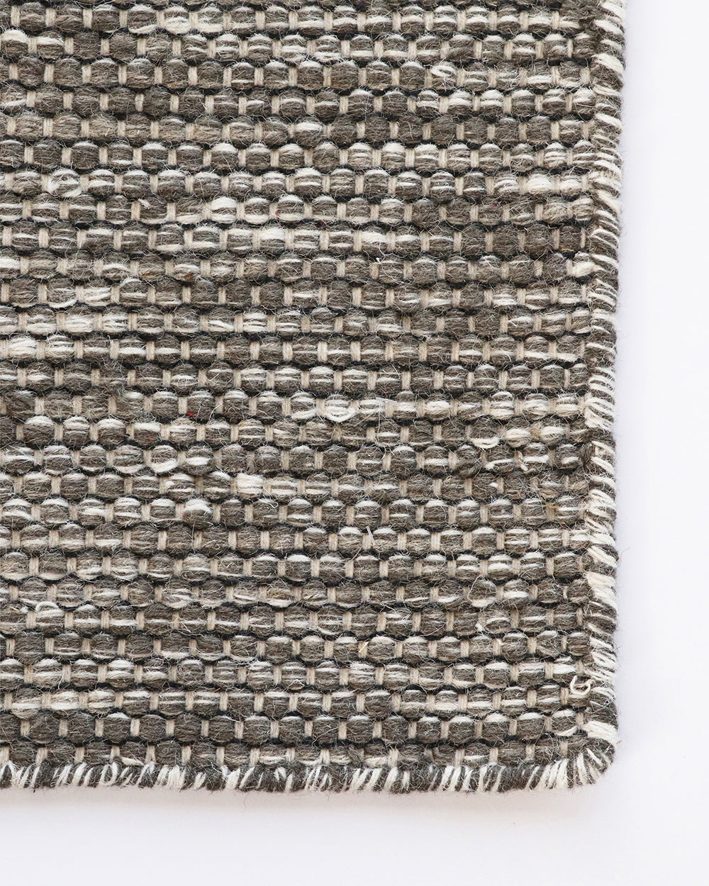 Abbas Floor Rug Tightly handwoven from a dense wool blend, the flatweave design and generous size of our Abbas makes this rug perfect for dining rooms and areas of high foot traffic. The mottled sand tone complements most interior styles and creates a ref