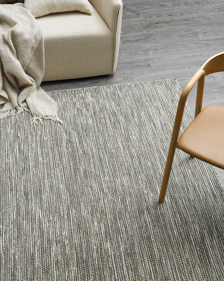 Abbas Floor Rug Tightly handwoven from a dense wool blend, the flatweave design and generous size of our Abbas makes this rug perfect for dining rooms and areas of high foot traffic. The mottled sand tone complements most interior styles and creates a ref