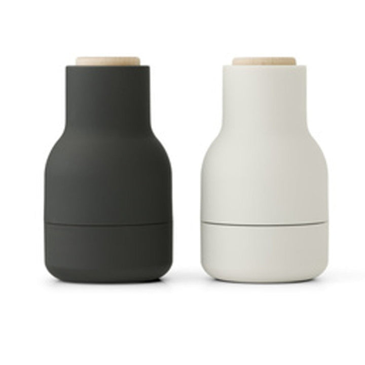 Audo CPH Bottle Grinder, Small by Audo Copenhagen - The Small Bottle Grinders come as a two-piece set of salt and pepper mills, each equipped with a robust ceramic mechanism that efficiently grinds various spices. Designed in a bottle shape that fits comf