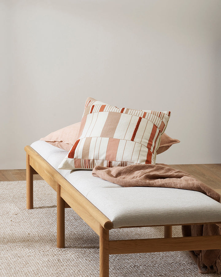 Ana Cushion Featuring a serene composition inspired by Korean Bogaji cloth, our Ana cushion adds a sense of tranquil sophistication to your space. The delicate linear design is complemented by small sections of tufted embroidery, adding a subtle surface t