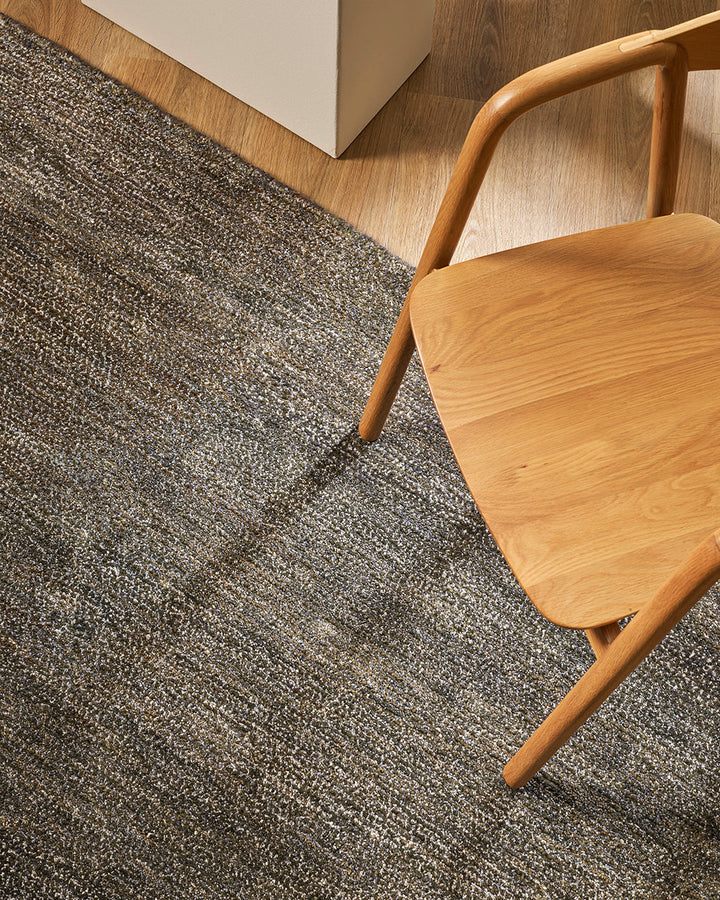 Anchorage Floor Rug Bring nature into your home with this handmade floor rug woven in natural fibres. A blend of bamboo silk and jute yarns gives the tufted surface subtle colour graduations, while the golden sand tone lays the foundation for a thoughtful