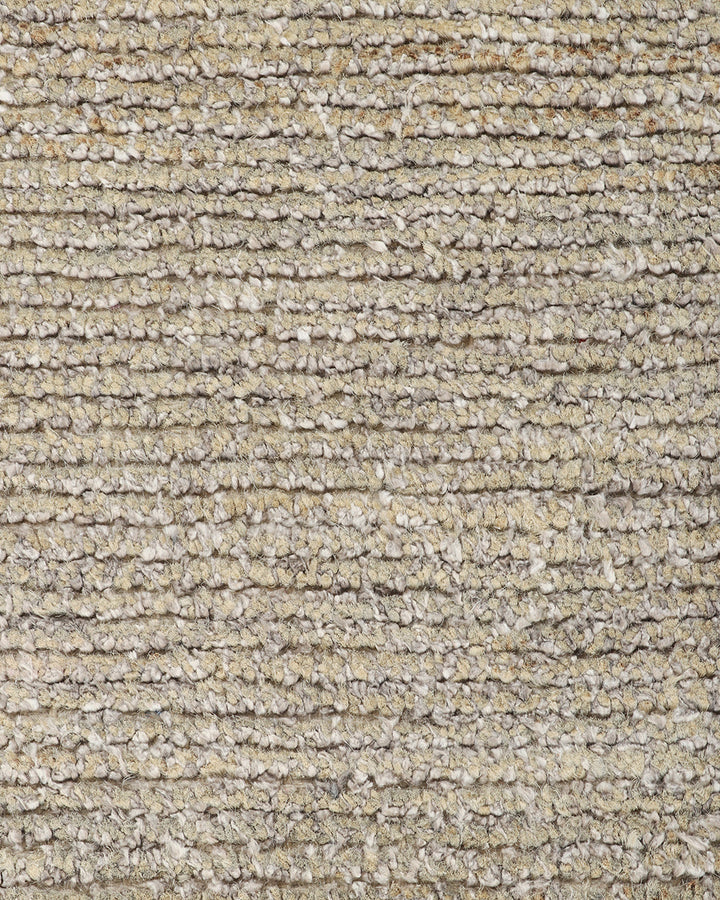 Anchorage Floor Rug Bring nature into your home with this handmade floor rug woven in natural fibres. A blend of bamboo silk and jute yarns gives the tufted surface subtle colour graduations, while the golden sand tone lays the foundation for a thoughtful