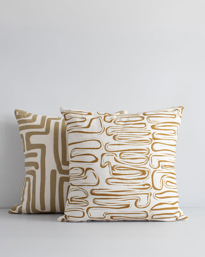 Anise Cushion Primal and abstract, the Anise makes a subtle, on-trend statement with organic hand-painted patterns. Warm tones of brass and ivory bring a sense of calm and serenity to spaces. Pair with sister cushion Chemin and core cushions Cassia Tobacc