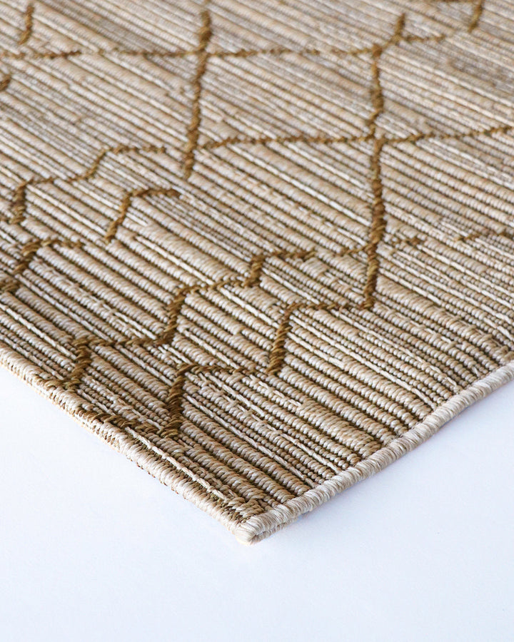 Aruba Floor Rug Featuring a textured weave with irregular linear patterning, the Arubaâ€™s golden earth tones add character and texture to a space. Suitable for use both in and outdoors, the durability and easy care features of the Aruba make it perfect o