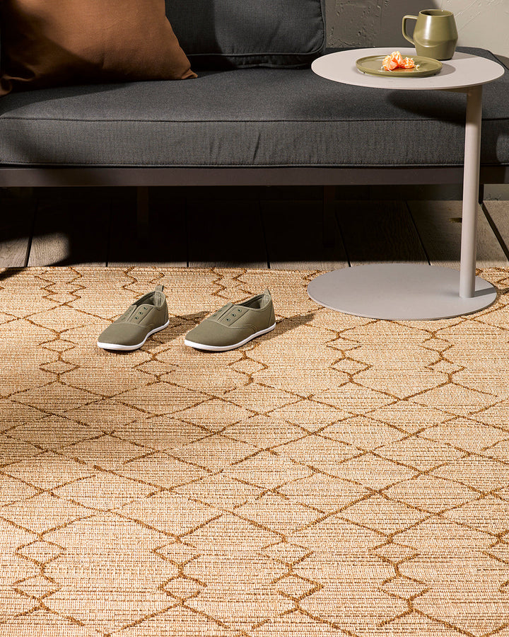 Aruba Floor Rug Featuring a textured weave with irregular linear patterning, the Arubaâ€™s golden earth tones add character and texture to a space. Suitable for use both in and outdoors, the durability and easy care features of the Aruba make it perfect o