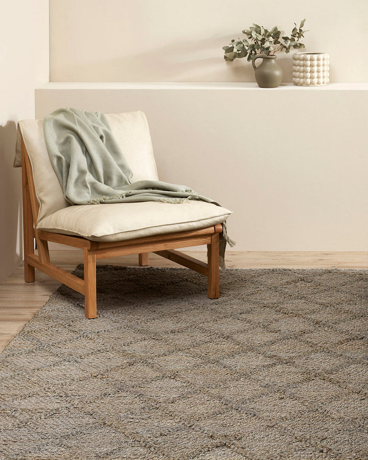 Assam Floor Rug Add earthy style to your home with the relaxed aesthetic of our Assam floor rug. Handwoven from 100% jute, this classic design creates visual interest through raw texture, rich colour, and subtle patterning. This dusky green tone brings a