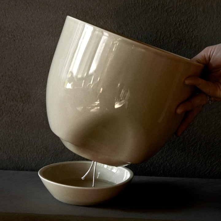 Audo CPH Hydrous Planter (Diam. 20 cm), Ashen by Audo Copenhagen - Product Information: Our clever, self-watering pot ensures easy plant care whether you are home or away. Shaped from stoneware glazed for a glossy finish, the practical design enables the