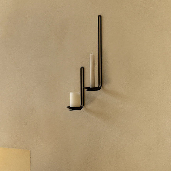 Audo CPH Clip Candle Holder (Height 34 cm), Wall by Audo Copenhagen - Product Information: Inspired by medieval candle holder designs, the Clip Wall Candle holder in black powder-coated metal or gleaming brass is simple in form yet powerful in expression.