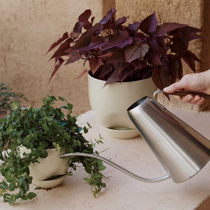 Audo CPH Hydrous Planter (Diam. 20 cm), Ashen by Audo Copenhagen - Product Information: Our clever, self-watering pot ensures easy plant care whether you are home or away. Shaped from stoneware glazed for a glossy finish, the practical design enables the
