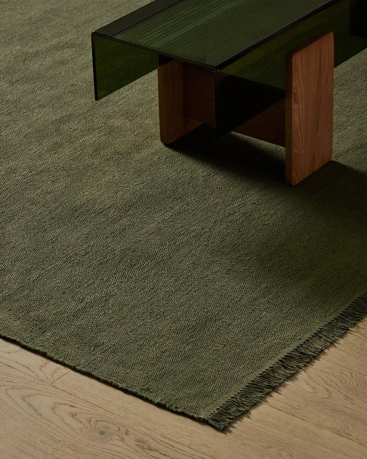 Emilio Kale - Premium Flat-Weave Linen Rug Transform your space with the Emilio Kale rug. Its deep forest green hue and fringe details offer effortless sophistication.