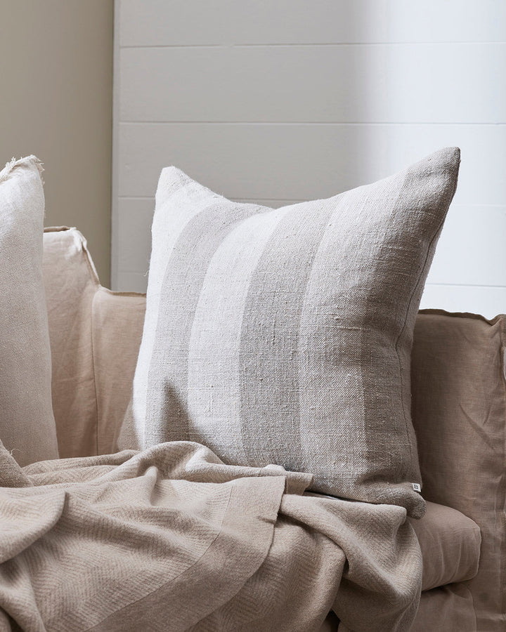 Bannockburn Cushion Create a calming, nurturing space with a modern take on coastal style. Perfect for summer, our Bannockburn cushion brings breezy and timeless style to interiors. Handwoven in a rich, textural linen, this design features a wide linear s