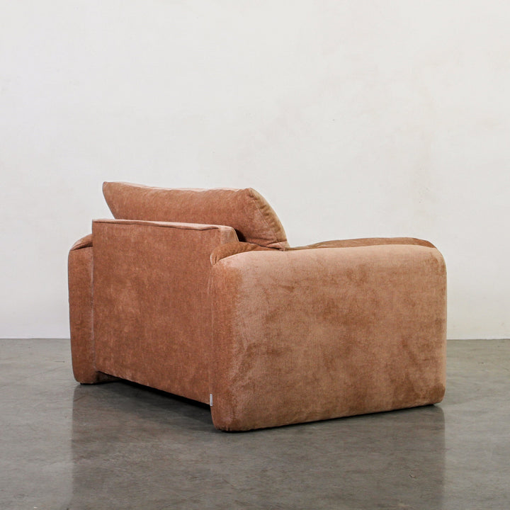 Alfie Single Seater Chai With soft lines and rich textures, our Alfie Single Seater in Chai Velvet is a gentle, sculptural piece designed to ground your space. As part of the Tender Forms collection, it embraces a cocoon-like silhouette, fold-over armrest