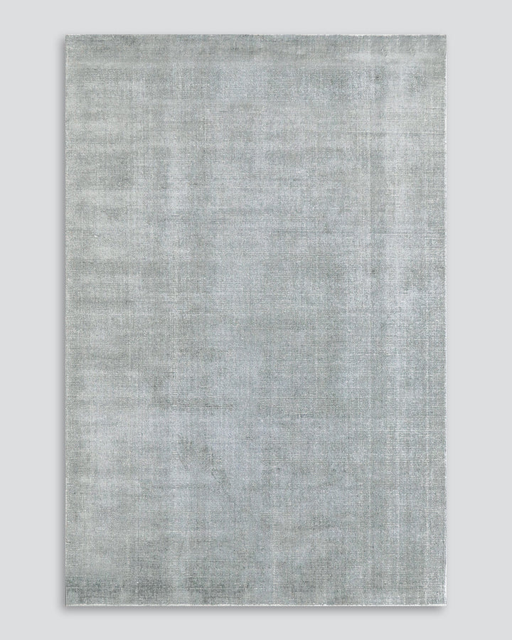 Belverde Floor Rug Embrace everyday luxury with the lustrous sheen and beautifully soft feel of the Belverde. Crafted from a blend of bamboo silk and wool, the low-cut pile and gently mottled slate tone makes this a tranquil addition to any interior. Aust