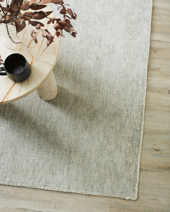 Belverde Floor Rug Embrace everyday luxury with the lustrous sheen and beautifully soft feel of the Belverde. Crafted from a blend of bamboo silk and wool, the low-cut pile and gently mottled slate tone makes this a tranquil addition to any interior. Aust