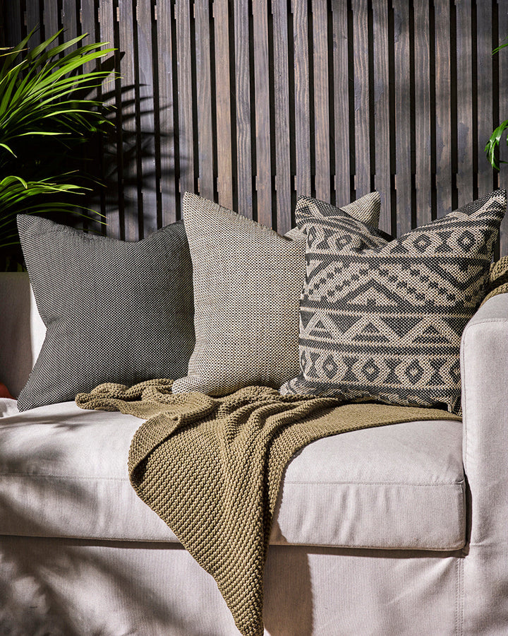 Bina Cushion Set the scene for a stylish, sun-soaked summer with the pared-back design of our Bina cushion. Featuring a textural 1-1 weave, the Binaâ€™s dark colourway is the perfect base upon which to style your outdoor space. Mix and match with other cu