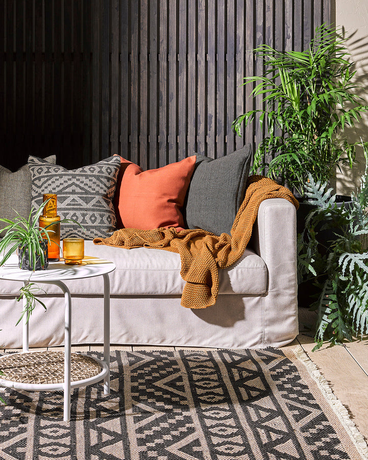 Bina Cushion Set the scene for a stylish, sun-soaked summer with the pared-back design of our Bina cushion. Featuring a textural 1-1 weave, the Binaâ€™s dark colourway is the perfect base upon which to style your outdoor space. Mix and match with other cu