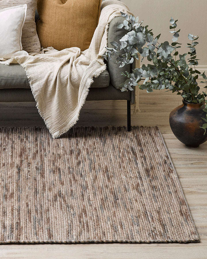 Boardwalk Floor Rug Immerse yourself in theÂ moodyÂ green tones of our Boardwalk floor rug. Space-dyed fibres of wool and cotton form a mottled pattern reminiscent of forest foliage. Rustic, with a refined feel, the Boardwalk invites us to create nurturin